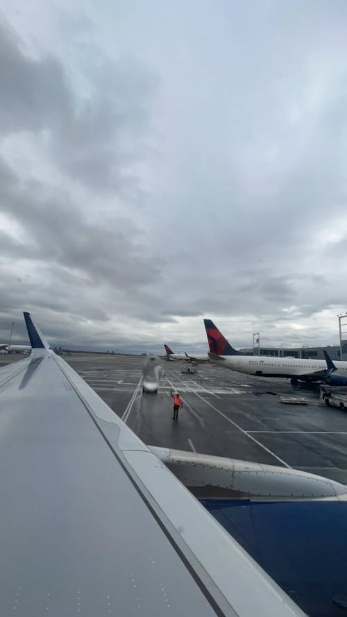 Time Lapse of a Plane Taxiing at the Airport under a Cloudy Sky