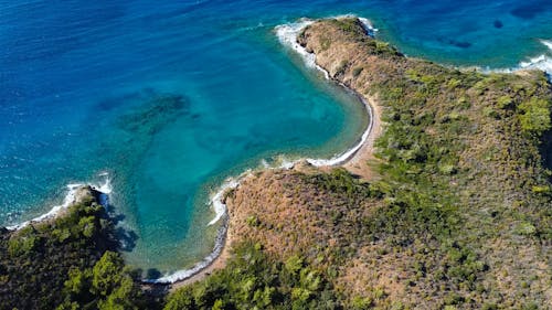 Aerial View of Breaking Waves on the Coast of an Island