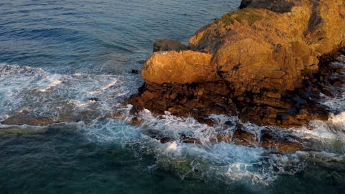 Breaking Waves on a Rocky Cliff