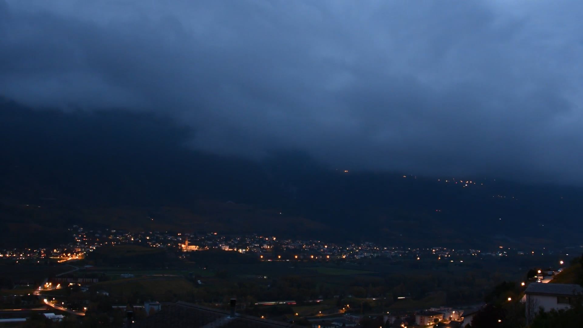 Time Lapse of Moving Clouds over a Small Town at Night Free Stock Video ...