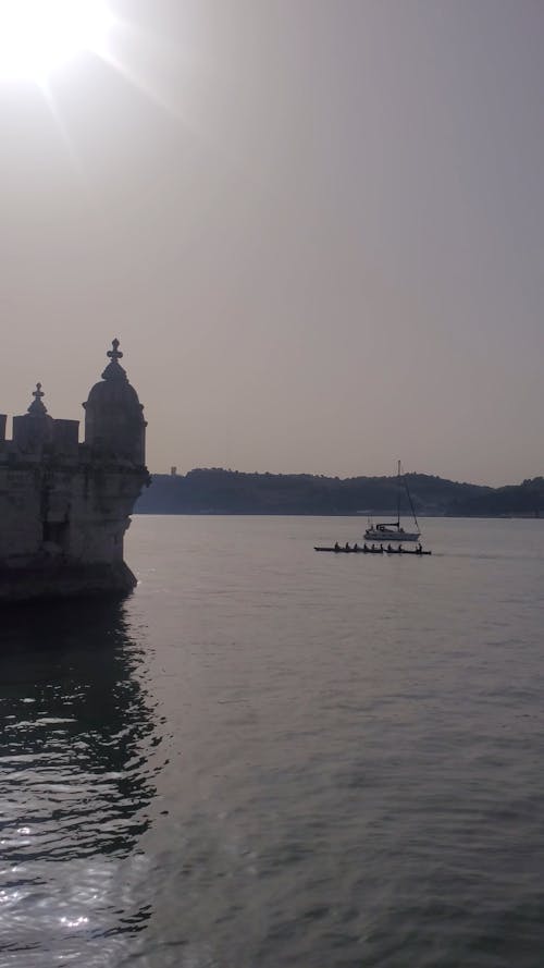 Silhouettes of Watercrafts on the Tagus River in Lisbon, Portugal 