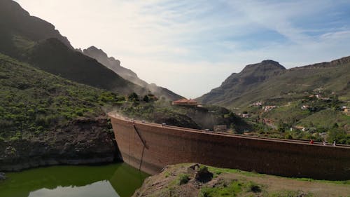 Vehicles Driving over the Ayagaures Dam in Gran Canaria, Spain 