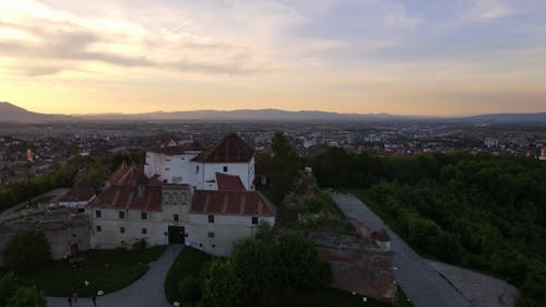 Drone Footage of a Medieval Fortress on Hill at Sunset