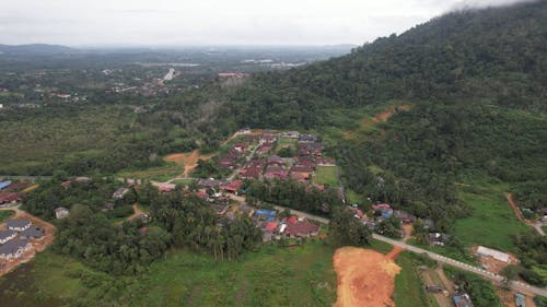 Aerial View of Village Houses in a Mountain Valley