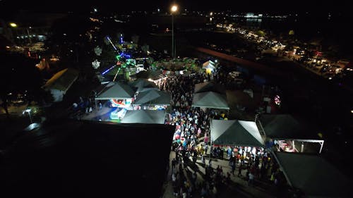 People at the Amusement Park at Night