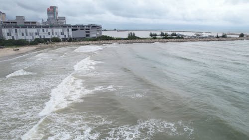 People Swimming on the Wavy Ocean 