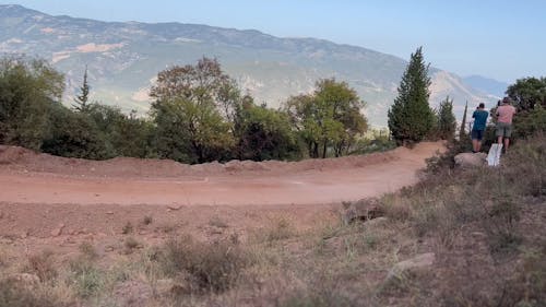 A Rally Racing Car Speeding on a Dirt Road