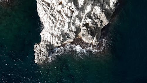 Top View of Coastal Rock Formations and Calm Sea Waters