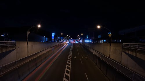 A Moving Cars on the Road at Night
