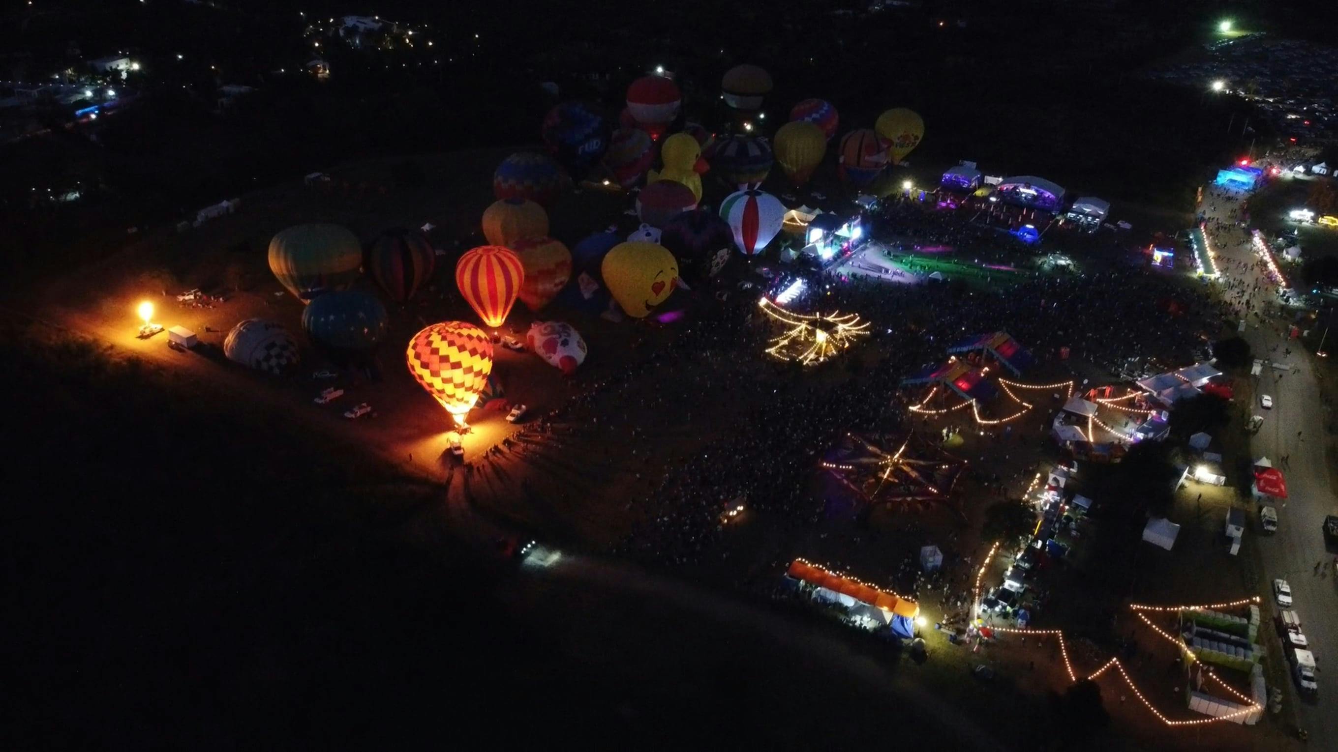 A Drone Footage of Hot Air Balloons with Lights at Night Free Stock