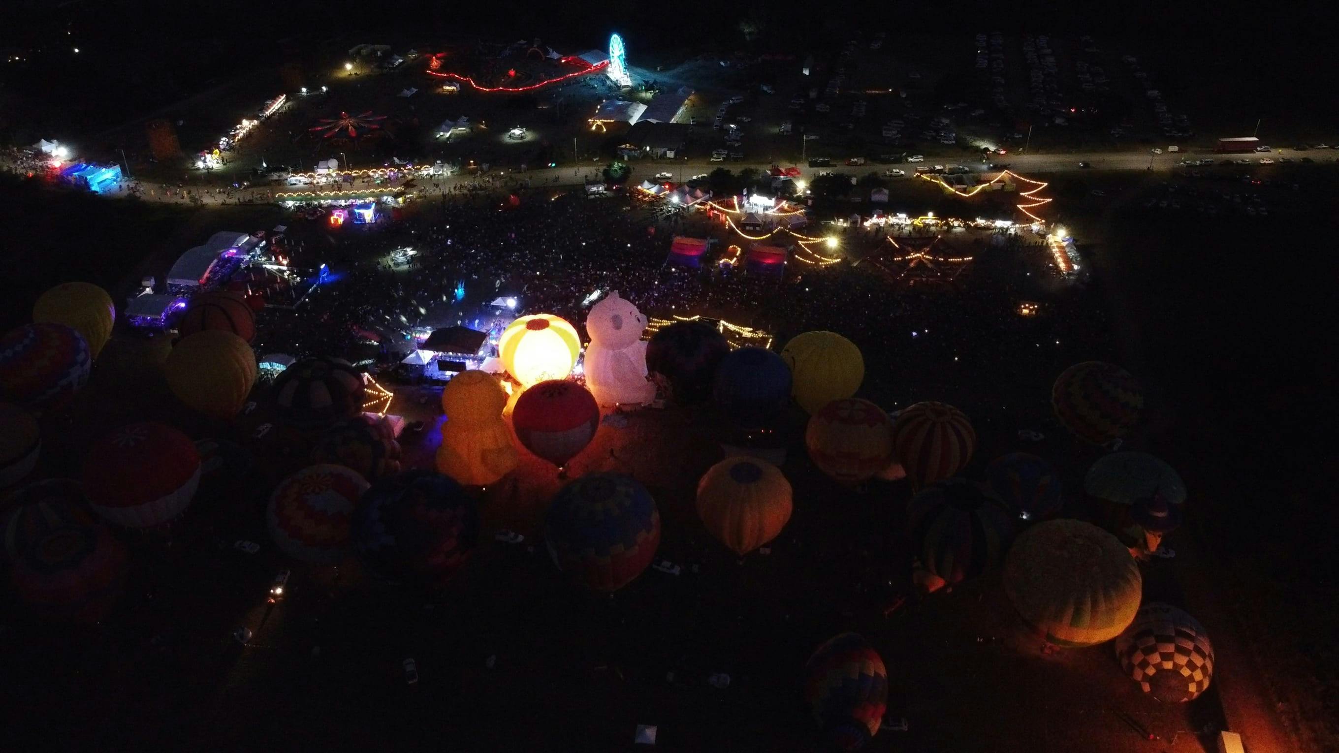 A Drone Footage of Hot Air Balloons with Lights at Night Free Stock