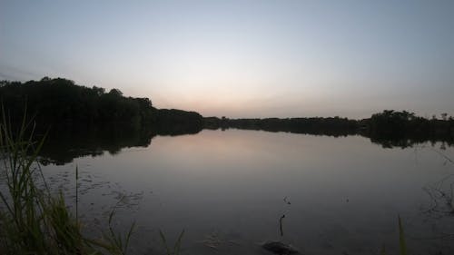 Timelapse over a lake as the sun sets