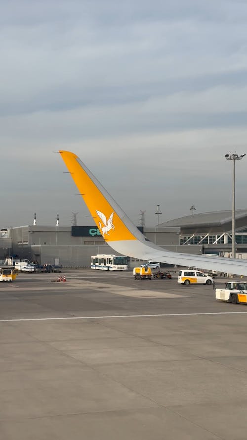 Parked Vehicles near an Airplane