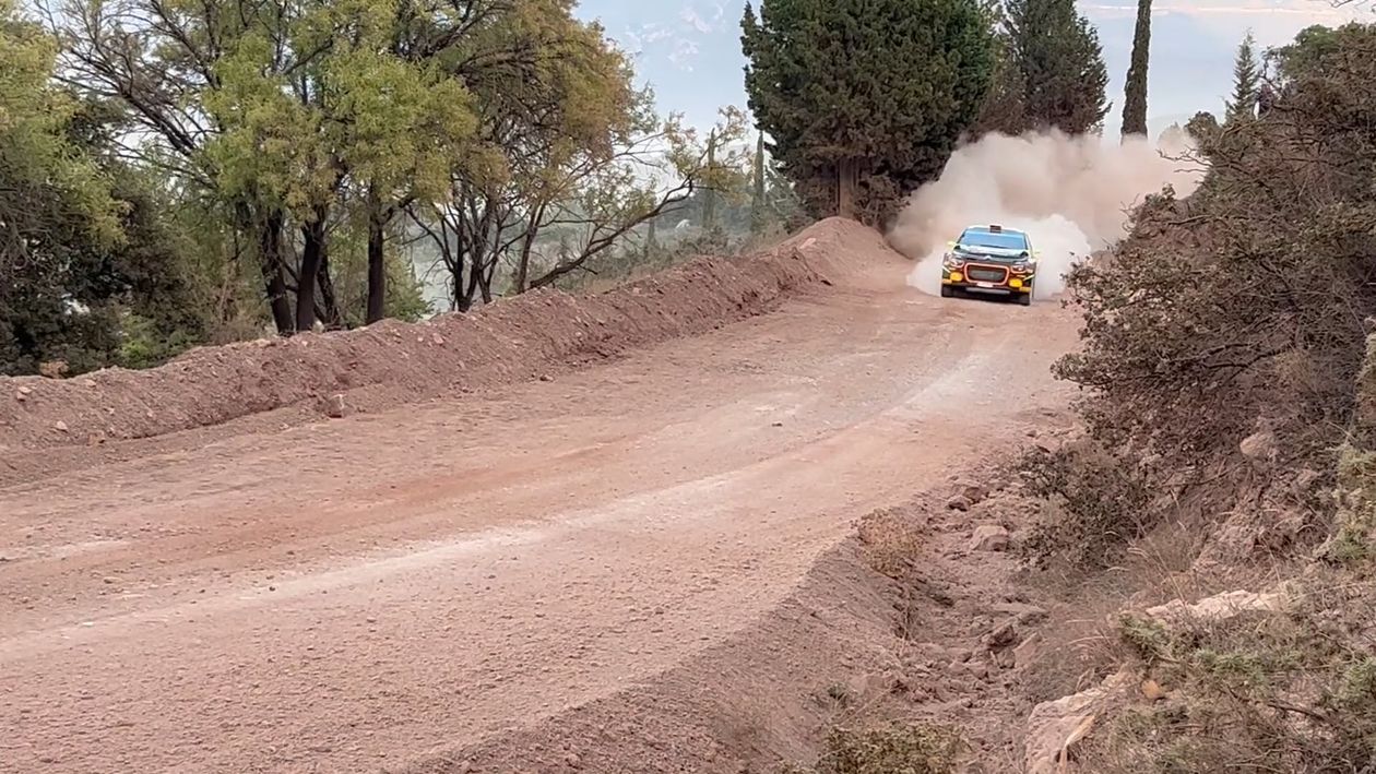 A Rally Racing Car Driving at High Speed on a Dirt Road Free Stock ...