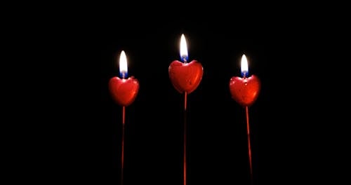 Burning Red Heart Shaped Candles