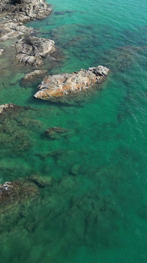 Drone View of a Rocky Shore and Sandy Beaches with Turquoise Water