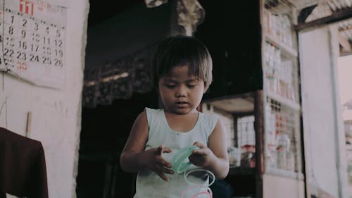 Kid Playing with a Broken Slinky