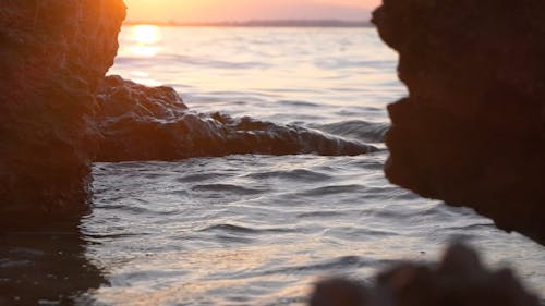 Ocean Waves and Golden Sunset in Slow Motion