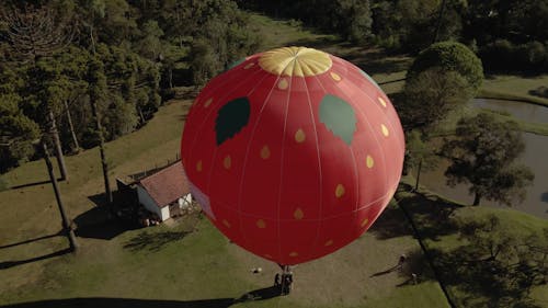 Drone Footage of a Hot Air Balloon Tethered by a Country House 