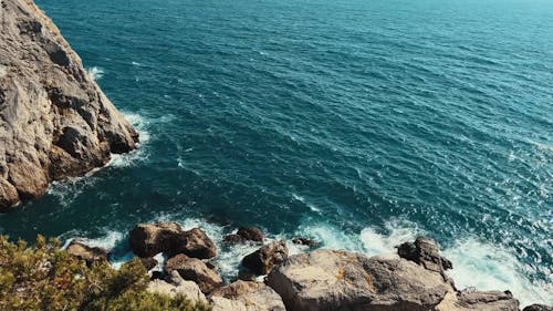 Coastal Rock Formations and Calm Sea Waters