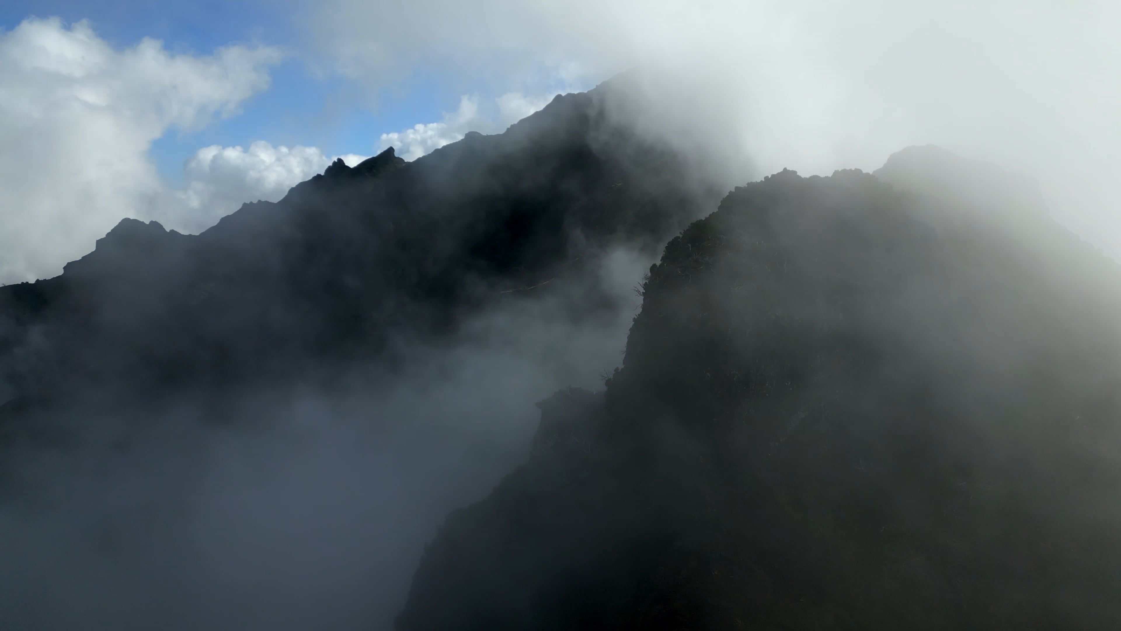 An Aerial Footage of Mountains Under the Cloudy Sky Free Stock Video ...