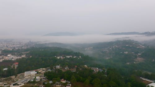 Low Clouds over a Town in a Mountain Area