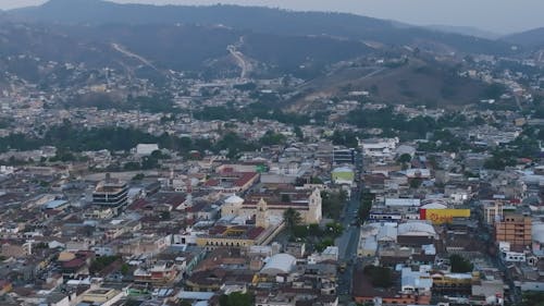 City Houses and Building near the Mountains 