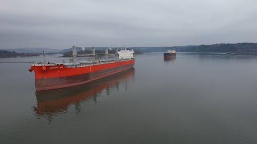 Cargo Ships on the Calm Body of Water 