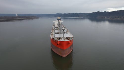 Drone Video of Cargo Ships on a River 