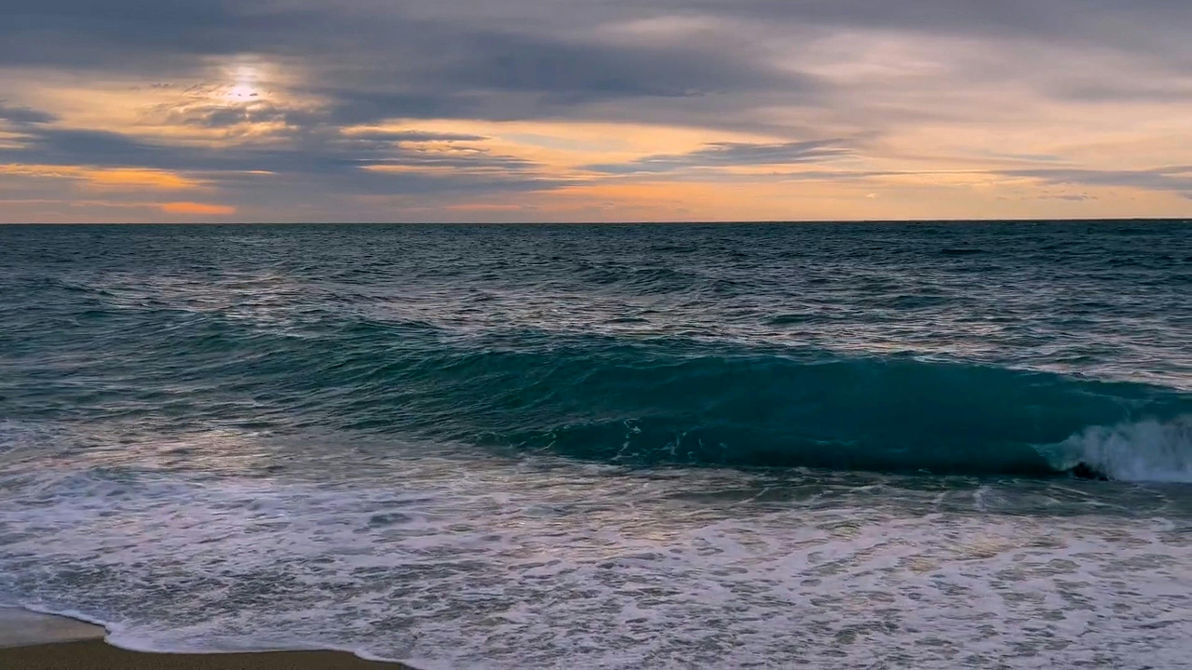 waves on shore at sunset 15170714