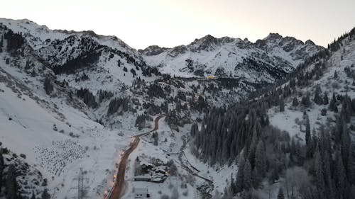 Aerial View of a Resort in a Snowy Mountain Landscape 