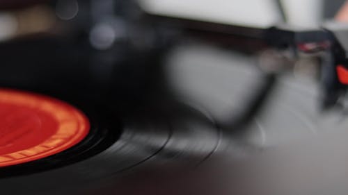 Close up of a Person Placing the Stylus on a Vinyl Record