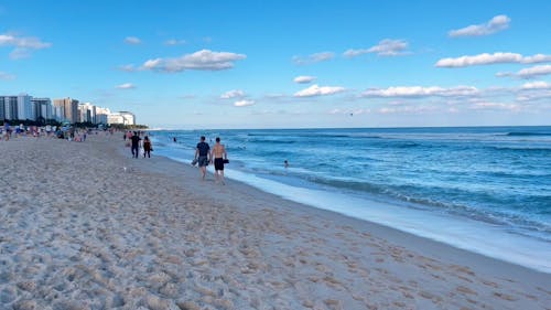 People Walking on the Seashore 