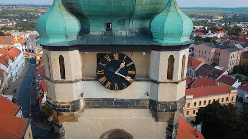 An Aerial Footage of a Church Between Houses in the City