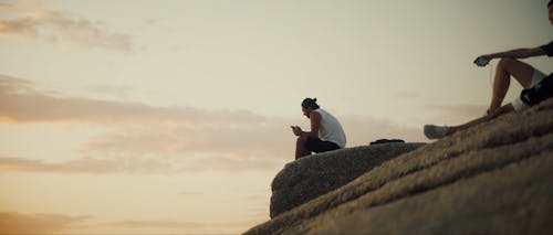 A Man Sitting on Rock