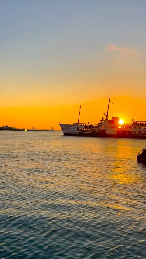 Watercrafts on Body of Water During Sunset