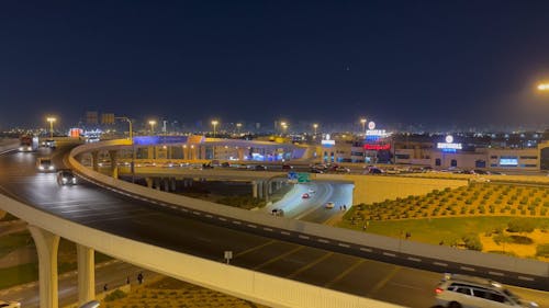 Cars Driving on City Roads at Night