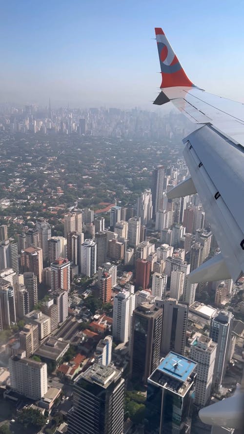 Aircraft Flying above a City