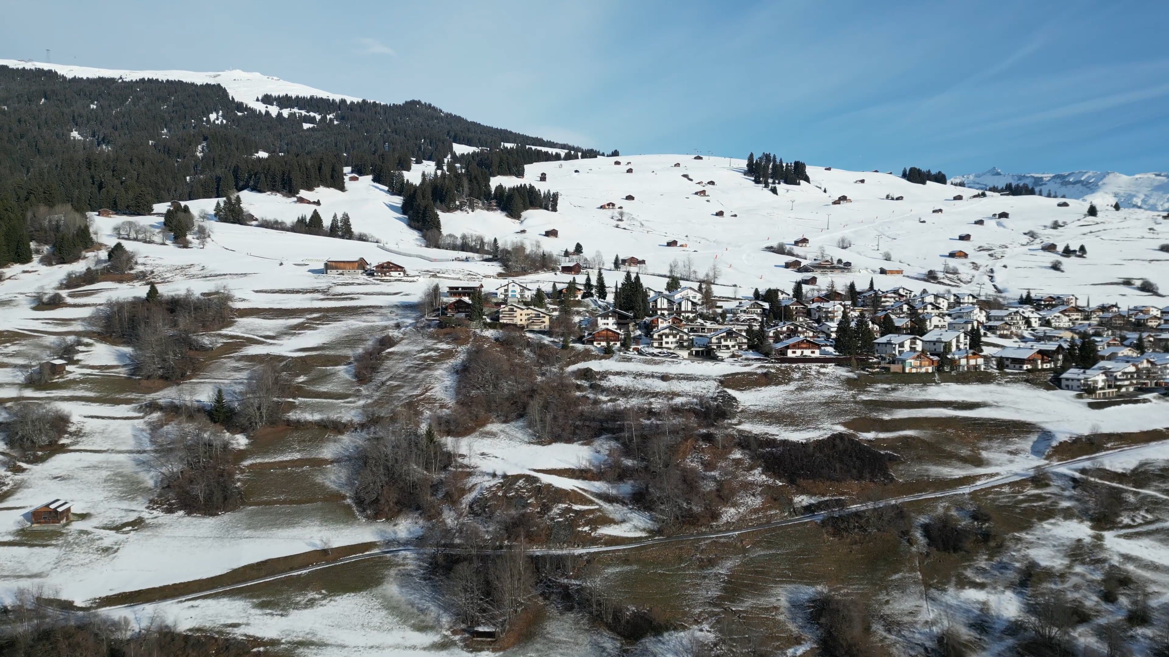 A Drone Footage of Houses on a Snow Covered Ground with Trees Free ...