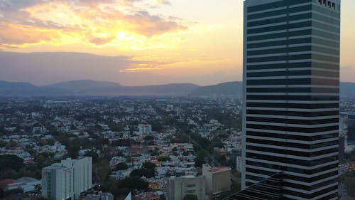 A Drone Footage of Hotel Riu Plaza Guadalajara Surrounded with Buildings in the City