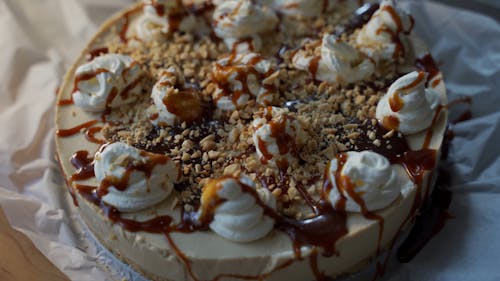 A Caramel Cake with Nuts and Icing on Top