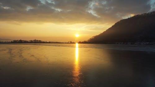 Drone Footage of a Frozen Lake at Sunset
