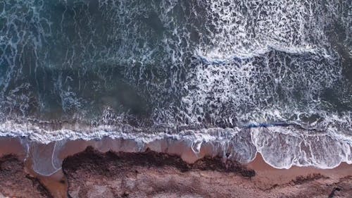 Top View of Breaking Waves on a Cliffed Coast