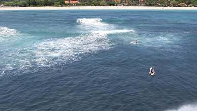 surfers at sea