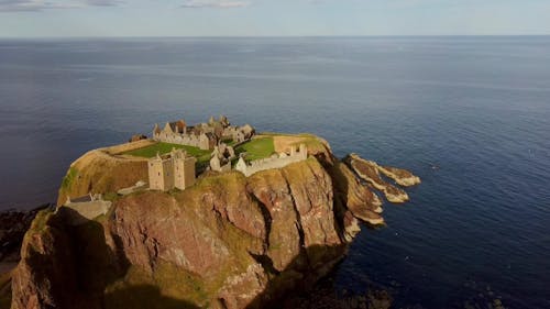 Aerial Footage of Dunnottar Castle on the Coast of Scotland 