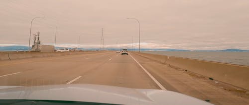 Cars Driving along a Highway by the Sea 