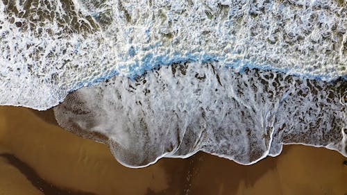 Top View of Sea Waves Reaching the Shore 