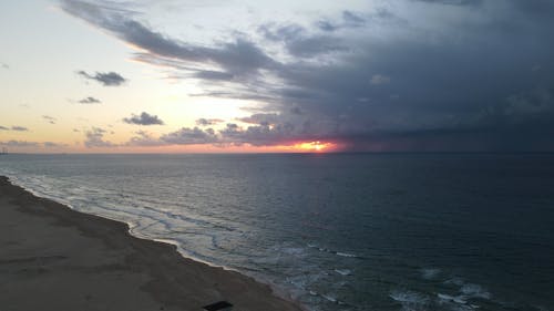 Storm Clouds over the Beach at Sunset 