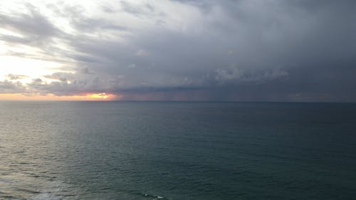 Storm Clouds over the Ocean at Sunset