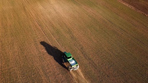 Drone View of a Tractor in a Farm Field 